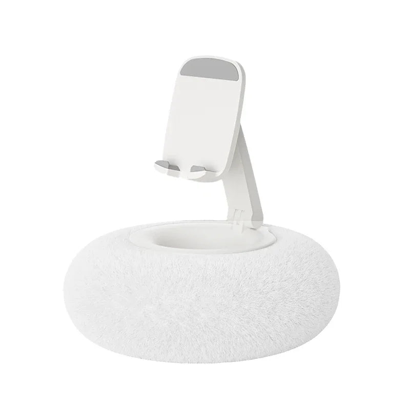 White adjustable phone stand with soft fluffy cushion base on white background β minimalist ergonomic holder by BeTrendy